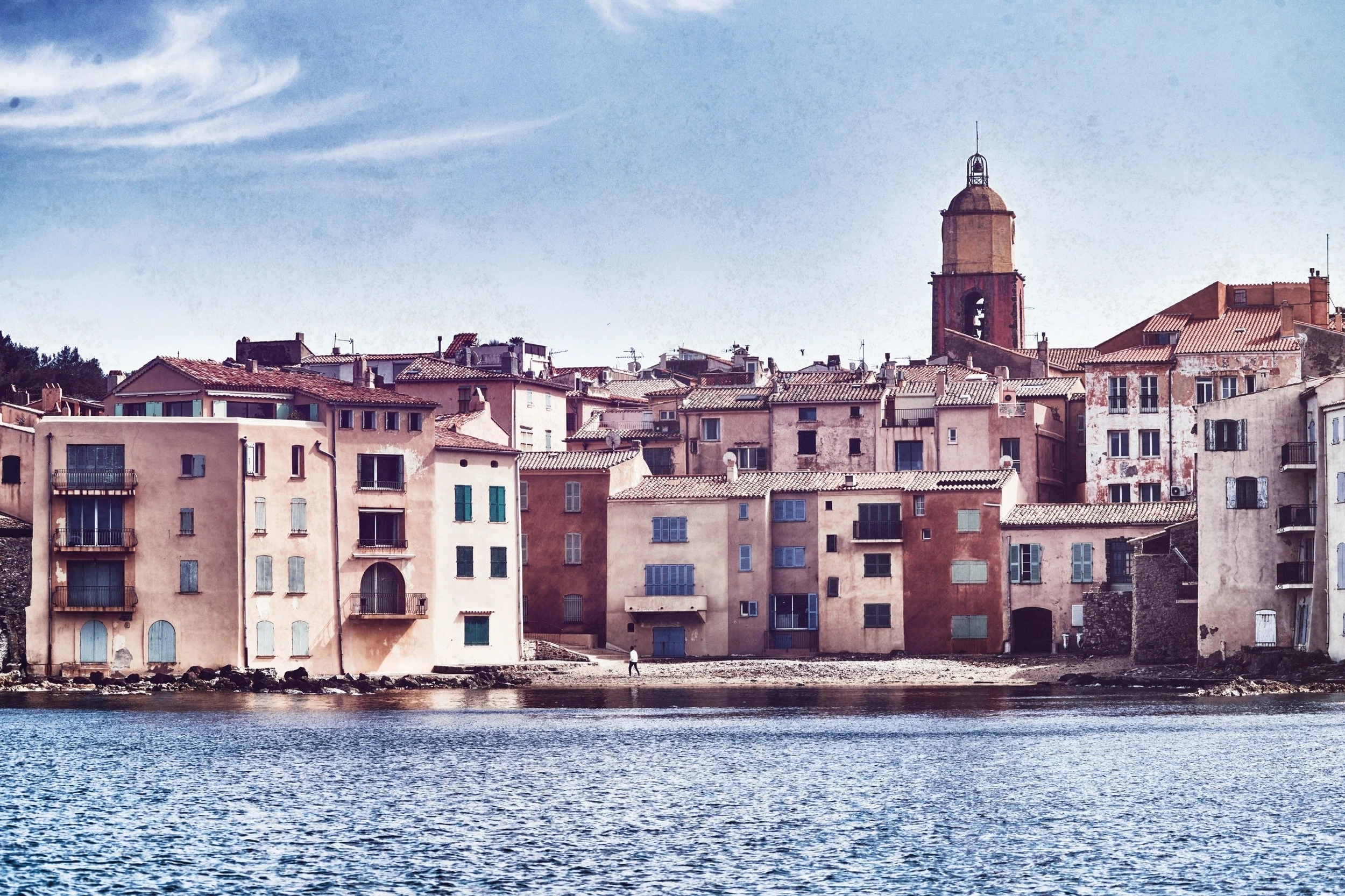 Colorful waterfront buildings and bell tower in Saint-Tropez — photograph by Michaël Gramm